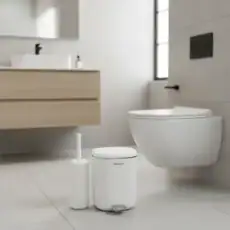 Homara Eco white pedal bin with toilet brush in a modern bathroom setting.